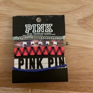 Victoria’s Secret Pink hair ties and bracelets